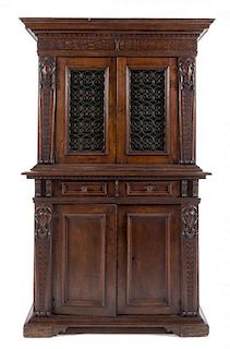 An Italian Renaissance Style Walnut Cabinet Height 79 1/2 x width 48 1/2 x depth 19 7/8 inches.