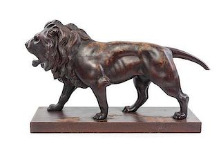 A Continental Carved Mahogany Figure Length 29 inches.