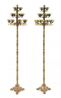 A Pair of Brass Fifteen-Light Torcheres Height 71 inches.