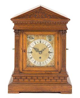 A German Oak Musical Mantel Clock Height 17 7/8 inches.