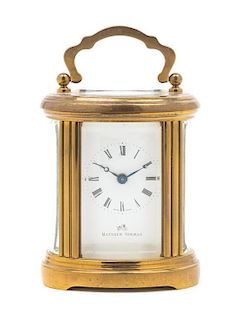 A Swiss Gilt Brass Carriage Clock Height 4 inches.