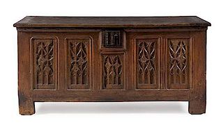 * A French Renaissance Iron Mounted Oak Chest Height 29 1/2 x width 61 7/8 x depth 25 1/2 inches.