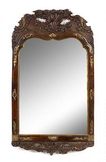 A Rococo Style Parcel Gilt Carved Mirror Height 32 1/4 x width 18 1/2 inches.