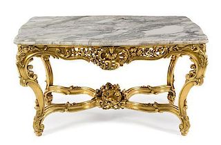 A Louis XV Style Giltwood Center Table Height 28 1/2 x width 52 1/2 x depth 33 inches.