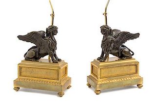 A Pair of Louis XVI Gilt and Patinated Bronze Models of Sphinxes Height 10 3/4 inches.