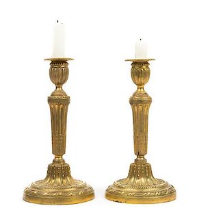 * A Pair of Louis XVI Style Gilt Bronze Candlesticks Height 10 3/4 inches.