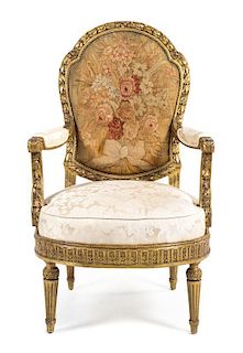 A Louis XVI Style Giltwood Fauteuil Height 46 inches.