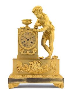 * An Empire Gilt Bronze Mantel Clock Height 20 1/4 inches.