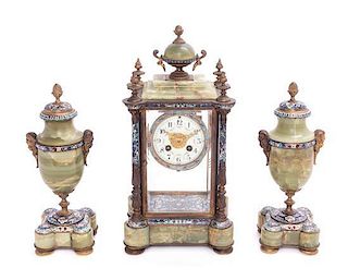 A French Gilt Bronze, Onyx and Champleve Clock Garniture Height of mantel clock 16 inches.