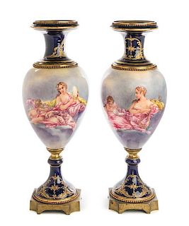 A Pair of Gilt Bronze Mounted Sevres Style Porcelain Urns Height 24 inches.