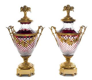 A Pair of Gilt Bronze Mounted Ruby Cut to Clear Glass Covered Urns Height 28 1/2 inches.