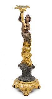 A French Gilt and Patinated Bronze Figural Candlestick Height 20 1/4 inches.