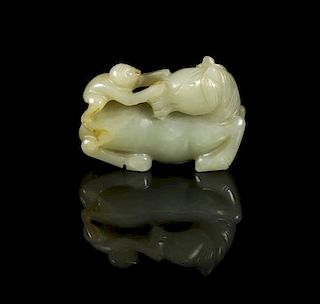 A Carved Jade Toggle of a Horse, Width 2 1/4 inches.
