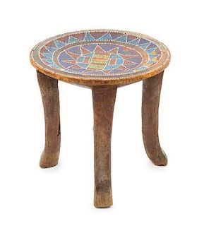* An Asante Beaded and Carved Wood Chief's Stool Height 12 1/4 x diameter of top 12 7/8 inches.