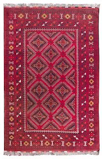A Turkoman Wool Rug 9 feet 9 inches x 6 feet 6 inches.