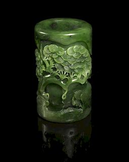 A Carved Green Jade Brushpot, Height 3 3/4 inches.