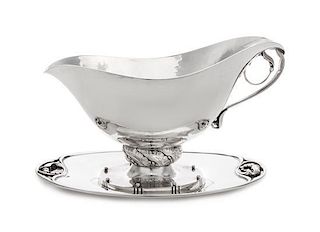 * A Danish Silver Sauce Boat and Underplate, Georg Jensen Silversmithy, Copenhagen, First Half 20th Century, the boat marked 