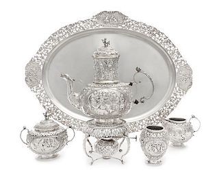 A Dutch Silver Four-Piece Tea Service, Maker's Mark VS, Amsterdam, 1917, comprising a teapot with burner and stand, creamer, 