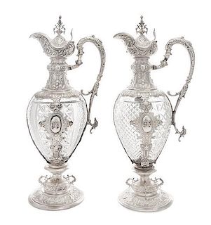 A Pair of Continental Silver Mounted Cut Glass Claret Jugs, Likely German, 19th Century, each having an urn finial above the 