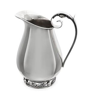 * An American Silver Water Pitcher, Alphonse LaPaglia for International Silver Co., Meriden, CT, Mid-20th Century, the scroll