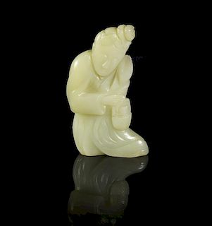 A Carved Jade Seated Figure, Height 3 3/4 inches.