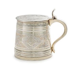 * A Russian Silver Child's Tankard, Maker's Mark Cyrillic H.A, Moscow, 1869, the lid and body chased with floral and foliate 