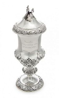 * A Russian Silver Cup and Cover, Teodor Werner & Son, Assay Mark Cyrillic S.P., Warsaw, 1874, the foliate and vine finial su