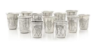 A Group of Eleven Russian Silver Beakers, Various Makers, Late 19th/Early 20th Century, each having a flared rim, the bodies 
