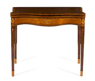 A George III Marquetry and Satinwood Inlaid Mahogany Game Table Height 29 1/2 x width 34 3/4 x depth 14 3/4 inches (closed).