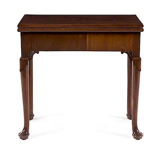 A George III Mahogany Flip-Top Game Table Height 28 3/4 x width 29 x depth 14 3/8 inches (closed).