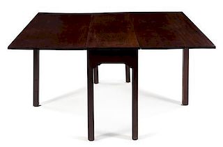 A George III Style Mahogany Drop-Leaf Table Height 28 1/2 x width 48 x depth 17 inches (closed).