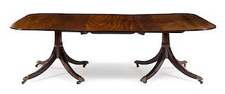 A George III Mahogany Twin-Pedestal Extension Dining Table Height 28 x width 70 (closed) x depth 48 inches.