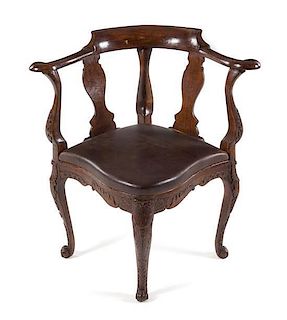 A Georgian Style Oak Corner Chair Height 31 1/2 x width 19 1/2 x depth 19 1/2 inches.