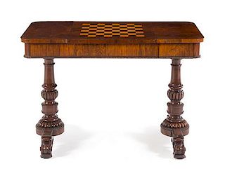 A Regency Rosewood Game Table Height 28 1/2 x width 42 x depth 20 3/4 inches.