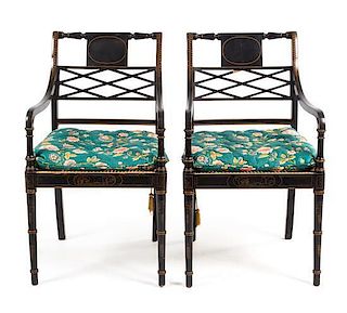 A Pair of Regency Style Parcel Gilt Ebonized Armchairs Height 36 1/4 inches.