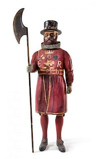 A Painted Composite Figure of a Beefeater Height overall 76 inches.
