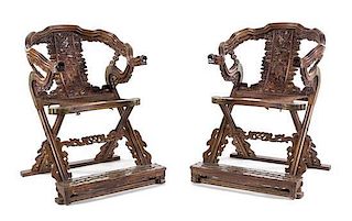 A Pair of Chinese Carved and Brass Mounted Folding Armchairs Height 42 3/4 x width 31 3/4 x depth 31 inches.