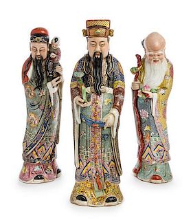 A Set of Three Chinese Famille Rose Porcelain Figures Height of tallest 19 inches.
