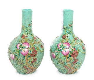 A Pair of Chinese Famille Rose Molded Porcelain Vases Height 16 inches.