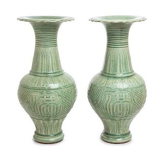 A Pair of Chinese Celadon Glazed Porcelain Vases Height 19 1/4 inches.
