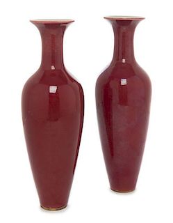 A Pair of Chinese Sang de Boeuf Porcelain Vases Height 9 1/4 inches.