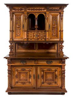 A Continental Renaissance Revival Style Buffet a Deux Corps Height 77 x width 62 x depth 27 3/4 inches.