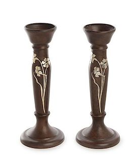 * A Pair of American Art Nouveau Silver Inlaid Bronze Candlesticks, Heintz Art Metal Shop, Buffalo, NY, the bronze stem of ba