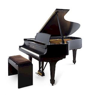 A Steinway & Sons Grand Piano Length of case 84 inches.