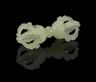 A Carved Jade Toggle of a Vajra, Width 2 5/8 inches.