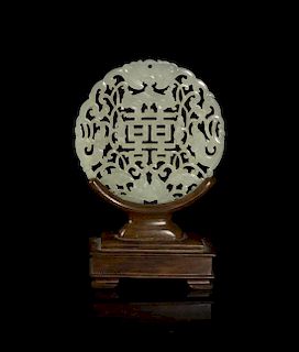 A Pierce Carved White Jade Plaque, Diameter 3 inches.