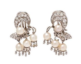 A Pair of Platinum, Diamond and Cultured Pearl Earclips, 9.60 dwts.