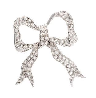 A White Gold and Diamond Bow Brooch, 6.40 dwts.