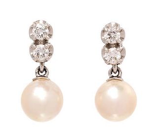 A Pair of White Gold, Cultured Pearl and Diamond Earclips, 4.40 dwts.