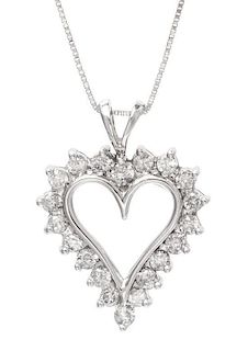 * A 14 Karat White Gold and Diamond Heart Pendant, 3.60 dwts.